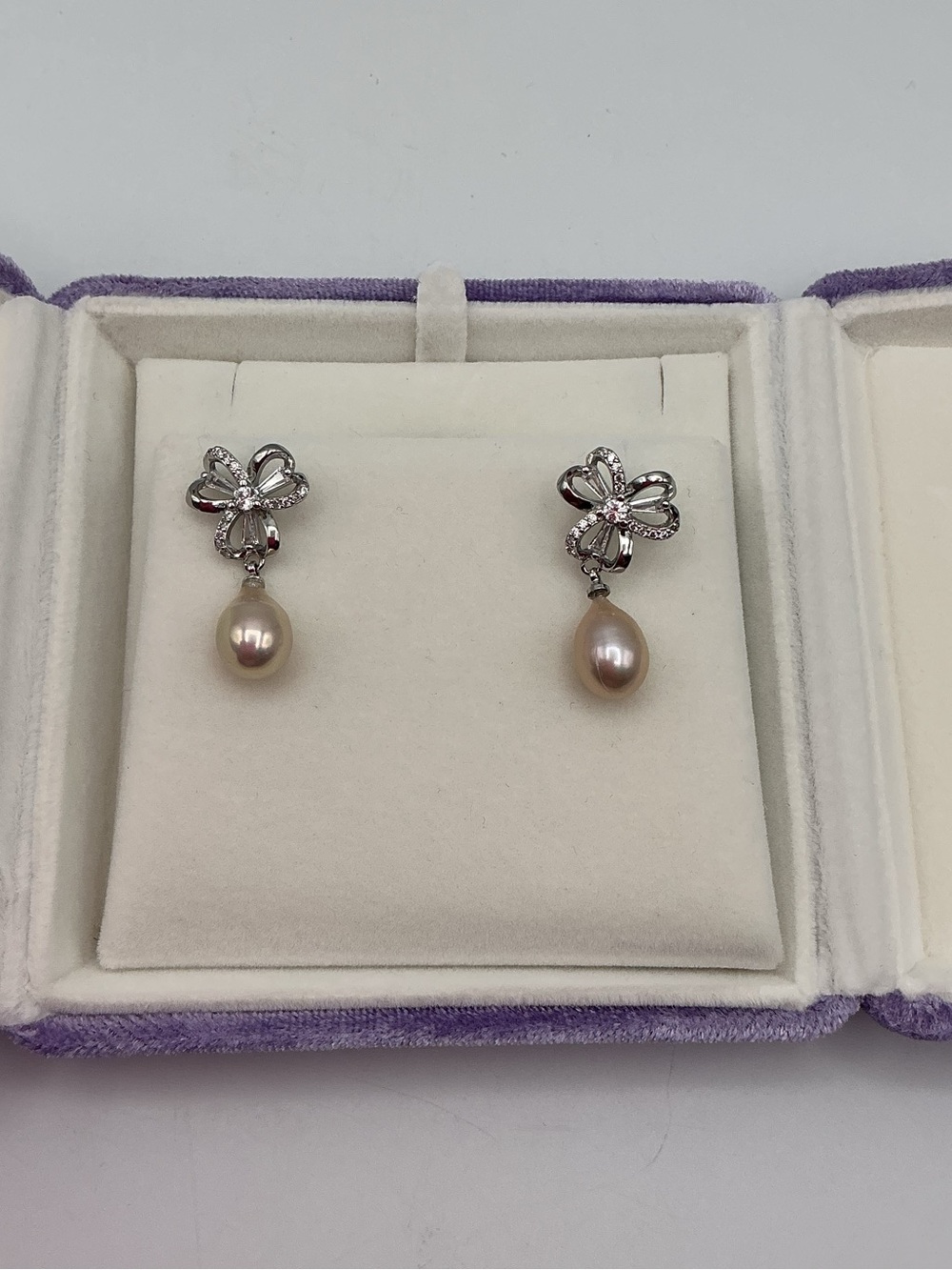 Silver Plated  Bow Drop Earrings with Peach Pearl Dangles